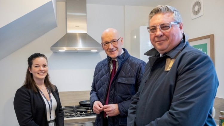 First Minister John Swinneywith SGN CEO Simon Kilonback and Lorna Archer 